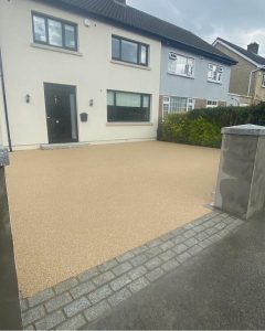 Resin bound driveway completed with granite cobbles steps walls and caps